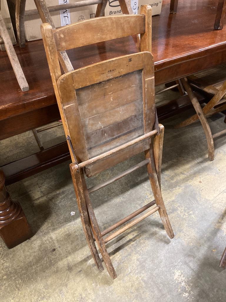 A set of eight early 20th century beech folding garden chairs